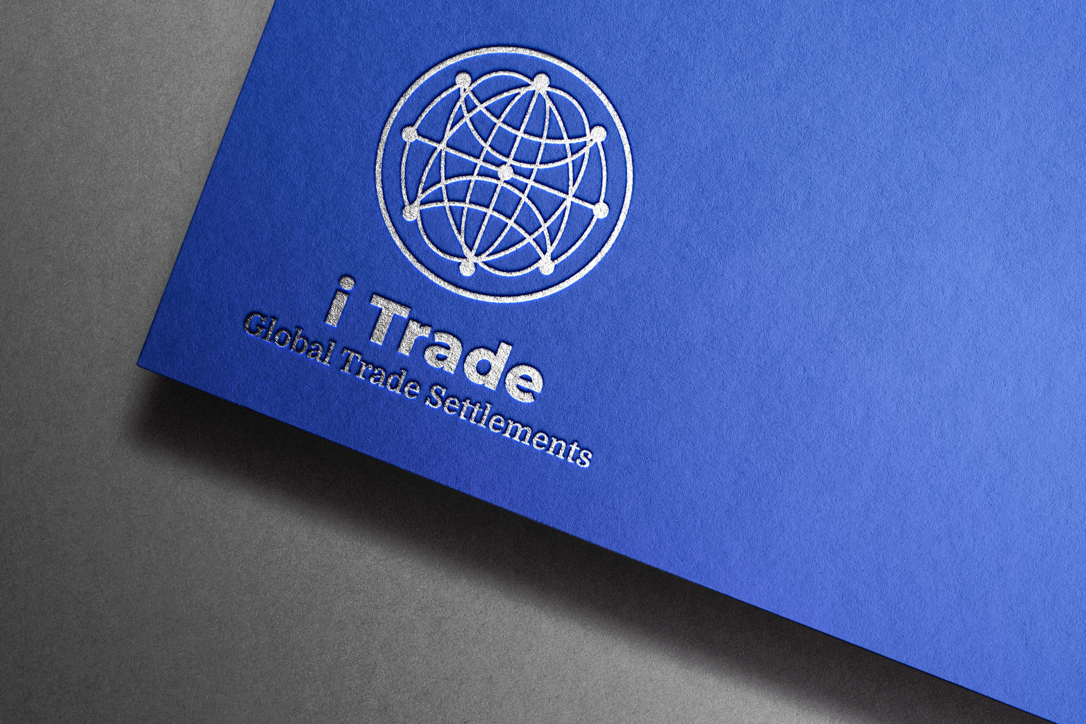 Embossed iTrade Global Trade Settlements logo on a premium blue paper mockup, showcasing a professional corporate branding and logo identity design (Variation 2).